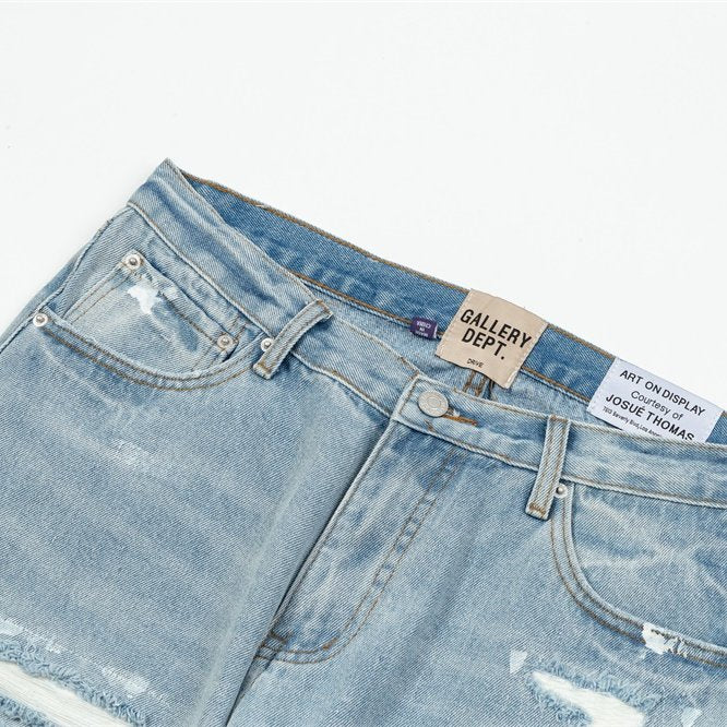 Gallery Dept Multi‑Rip Paint‑Splatter Flare Jeans