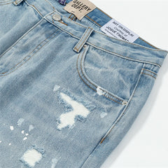 Gallery Dept Multi‑Rip Paint‑Splatter Flare Jeans