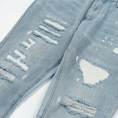 Gallery Dept Multi‑Rip Paint‑Splatter Flare Jeans